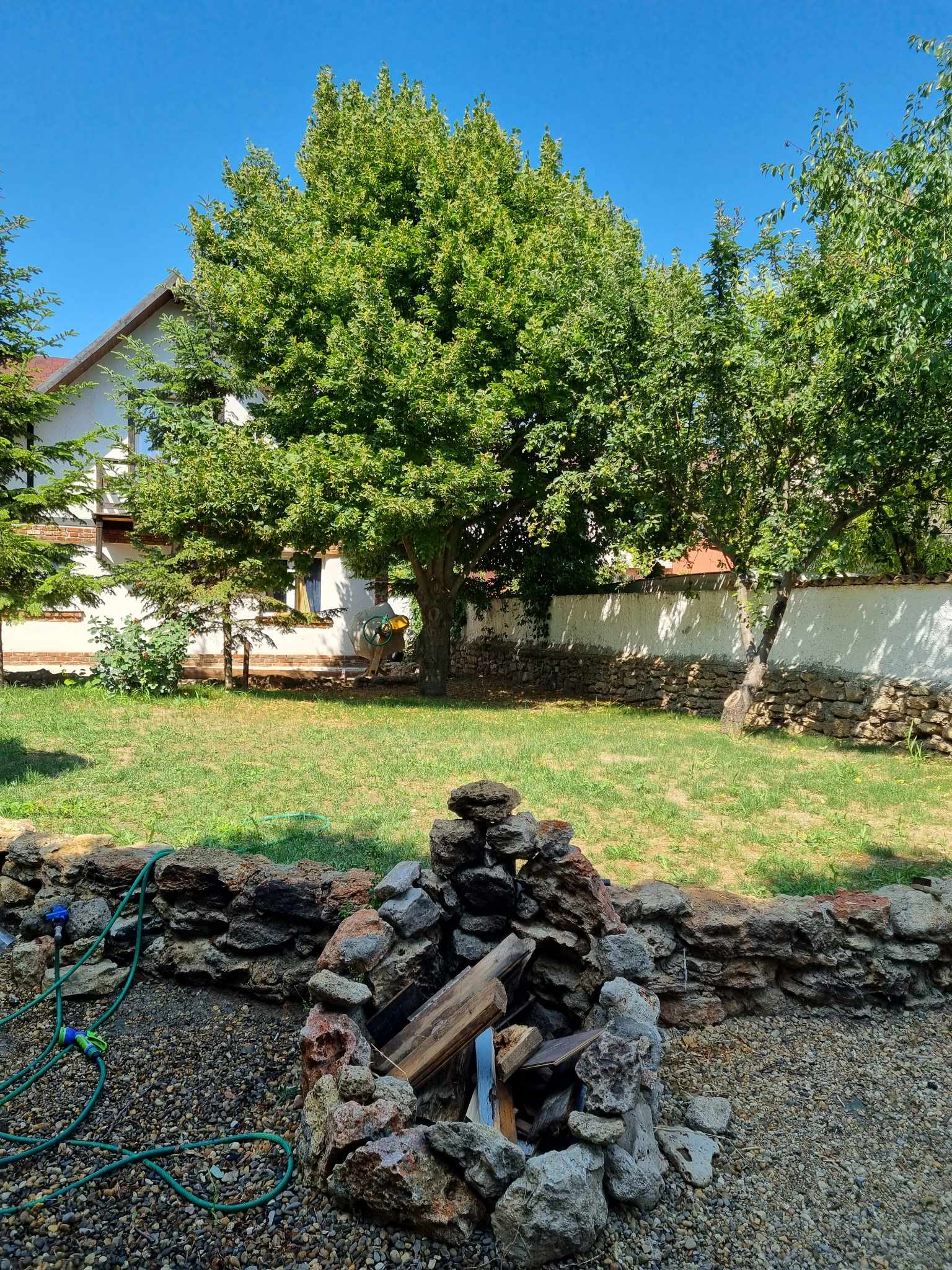 Stone water feature in the garden at Magic Garden